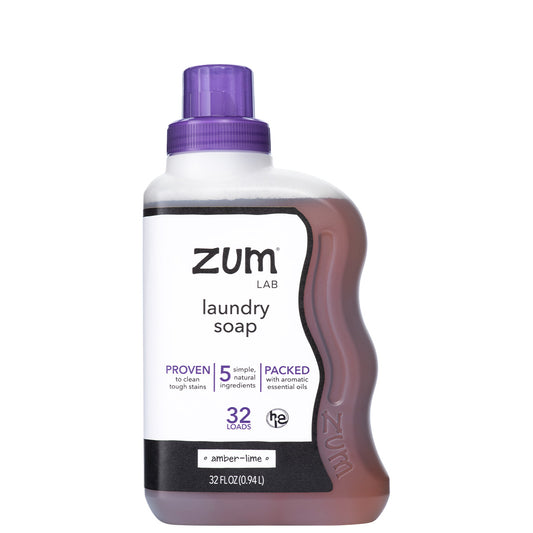 front of Amber-Lime Laundry Soap bottle with black and white label and purple cap.