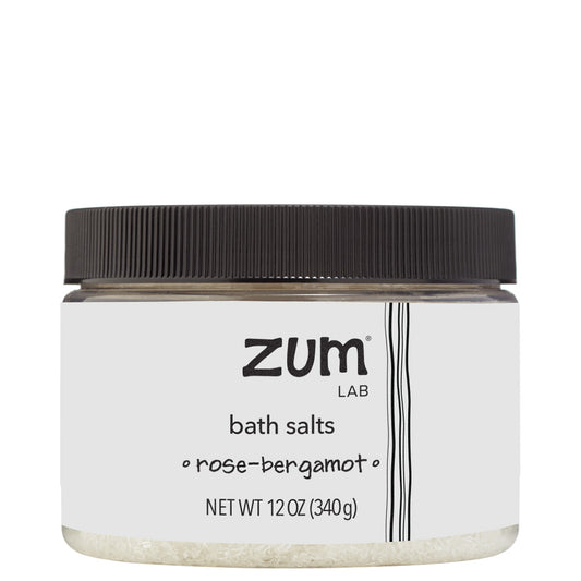 Rose-Bergamot Bath Salts in a clear plastic container with label and black lid.