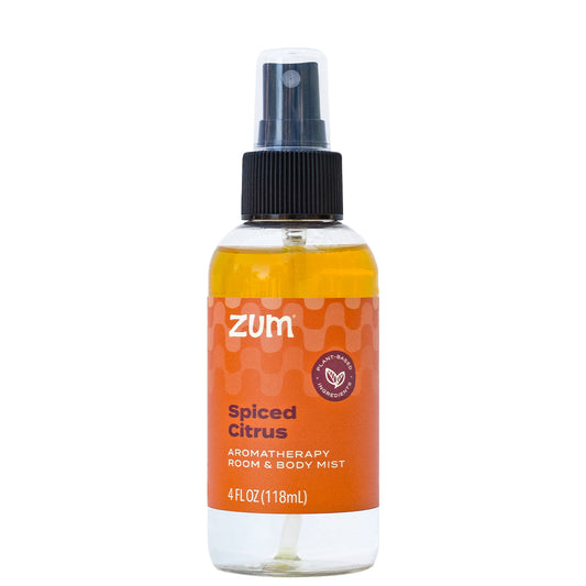 Spiced Citrus Mist in a clear bottle with black spray top cap.