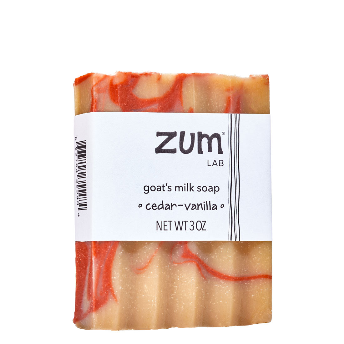 Red and tan swirled goat's milk soap bar with white label. Scented with cedar-vanilla.